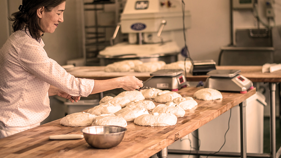 Photo of a baker making bread
