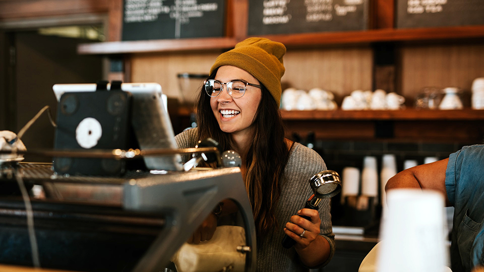 Photo of a barista at the store counter